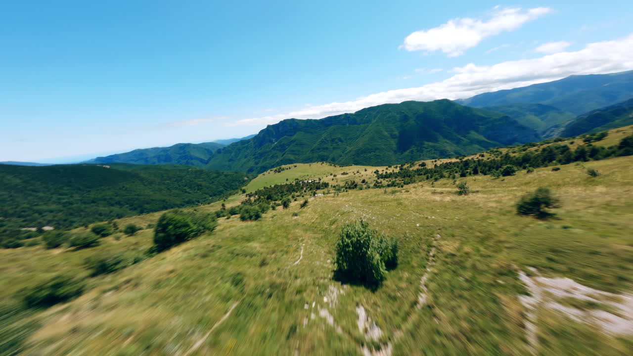 Monte Mongioie FPV flight over green valleys and distant mountains