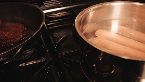 vegan plantbased hotdogs and burgers cooking on gas stove