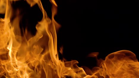 Flames-of-fire-on-black-background-in-slow-motion