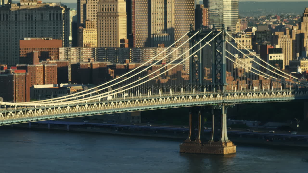 Aerial view of the Manhattan Bridge at sunrise. Shot along the East River in New York City.