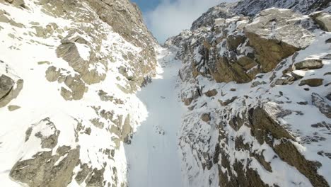 ascending up a snowy couloir in northern norway