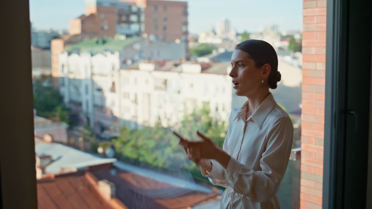 Shocked businesswoman listening smartphone interlocutor feeling anger at office