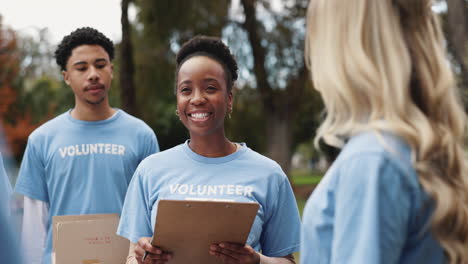 group of volunteers smiling and working together