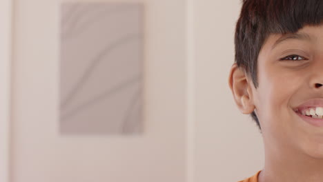 smiling boy showing half face, close-up portrait in casual setting, copy space