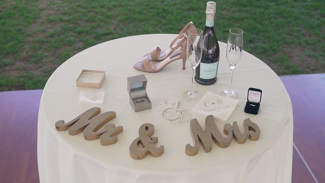 Panning down shot of bride and groom table at wedding filmed in the White Mountains of New Hampshire at Lake Winnipesaukee