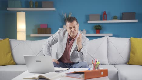 Home-office-worker-man-looking-nervously-at-camera.