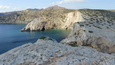 establishing drone aerial shot of neverland bay, ios near magganari beach in greece