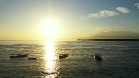 boats moored in the sea on soft orange light