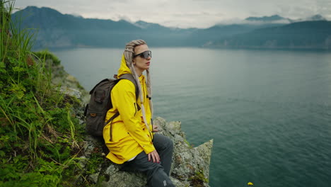 woman hiking by a lake