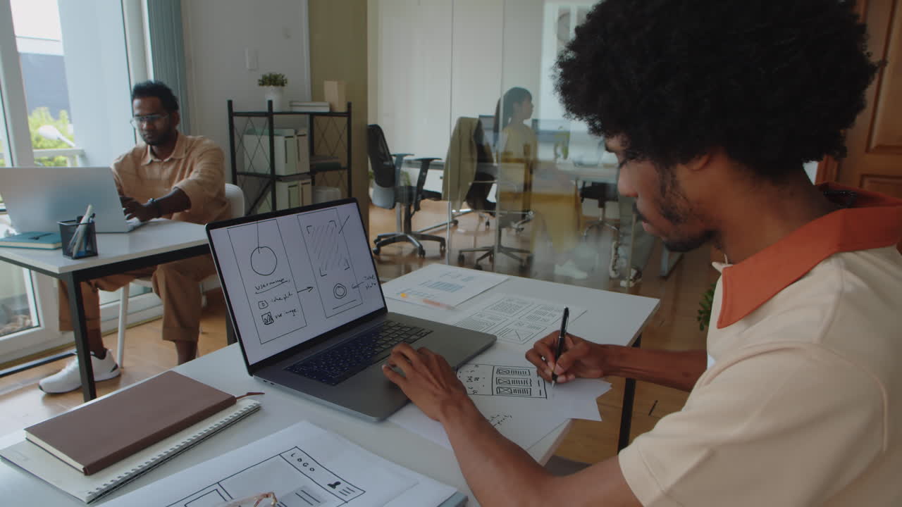 UX Designer Working on Interface of Mobile Application