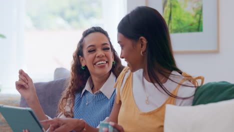 Women-together,-tablet-and-talking-on-sofa