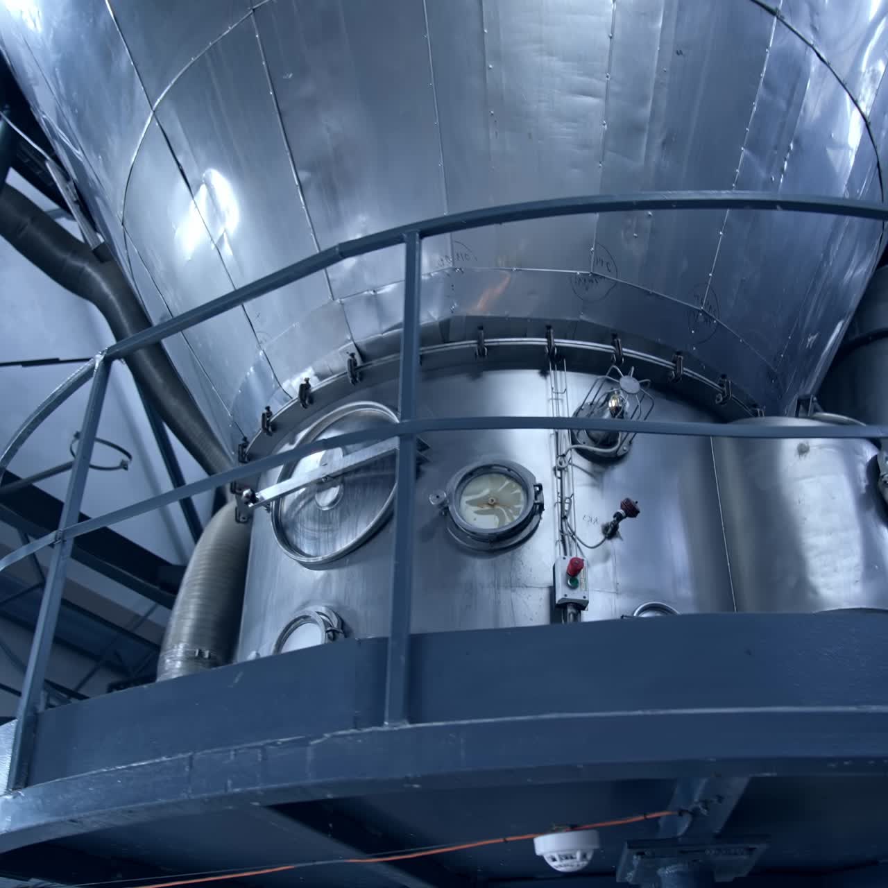 Large milk processing plant. Modern metal equipment inside the factory for production of dairy products. Dairy food production plant