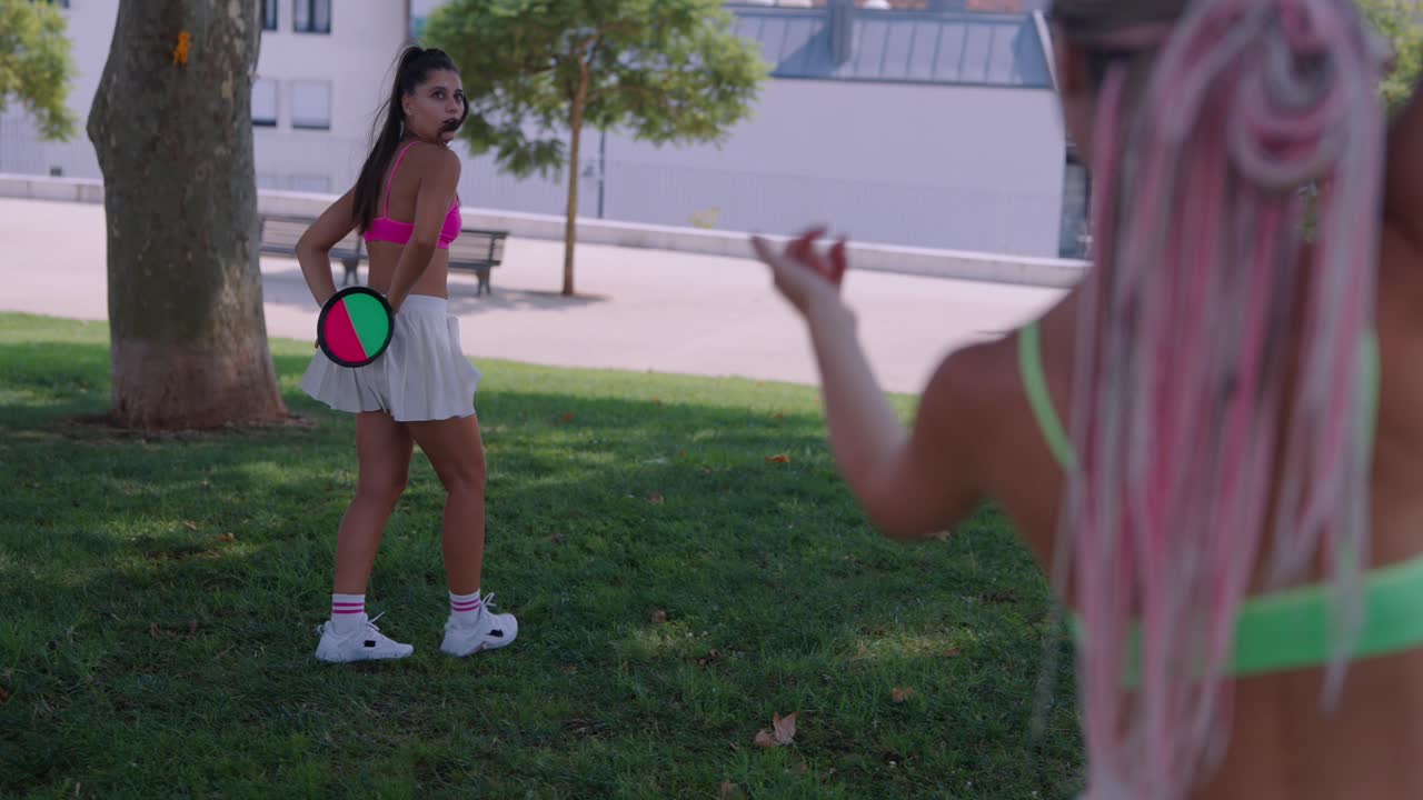 Women playing disc in a park