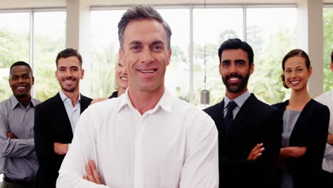 business executives with arms crossed at conference center