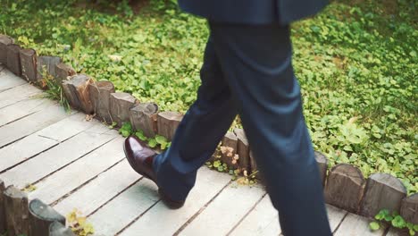 close up of an elegant male shoes walking on the street. slow motion.