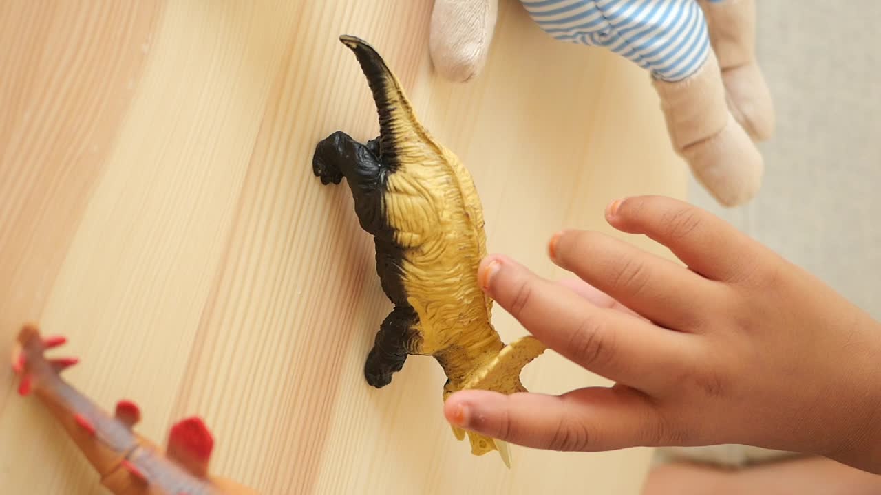 Toy dinosaur on wooden surface