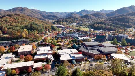 western caroina university aerial push in in the fall with autumn leaves