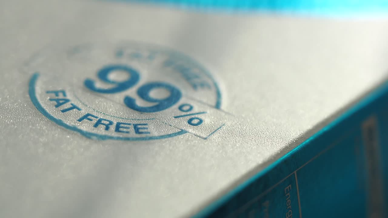 Close-up of a food package label with a 99% fat-free claim