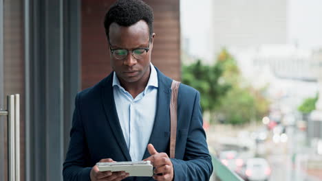 Tablet-research,-balcony-and-black-man-typing