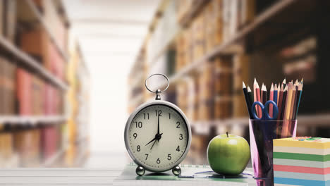 animation of school items and clock with books in row in background