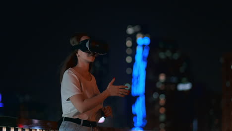 young girl simulated virtual reality work in glasses in modern big city at night on my lanterns and beautiful bokeh of passing cars and buildings