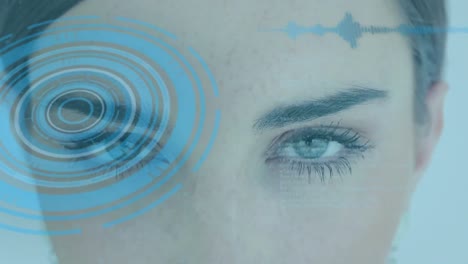 animation of scope scanning and data processing over woman's face in background