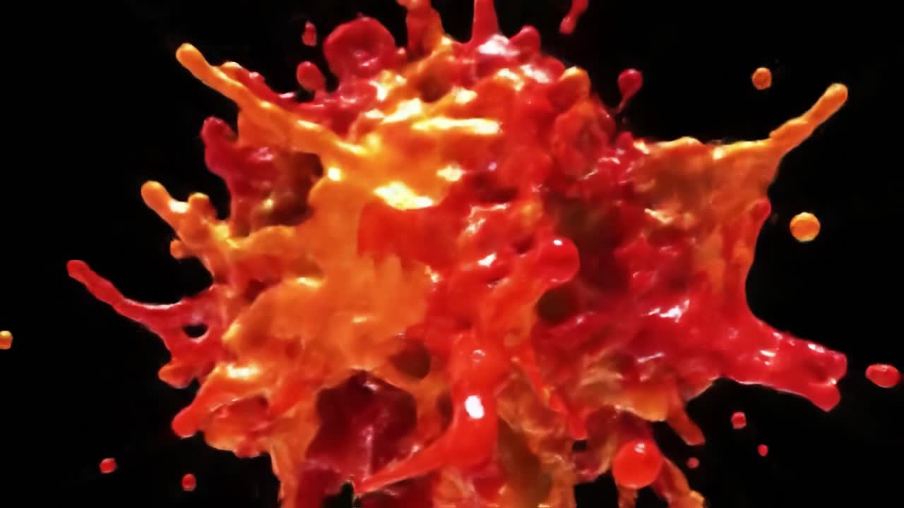 Vibrant Explosion of Colorful Liquid Splashes Captured in Stunning Detail, Featuring Dynamic Movement and Vivid Red and Orange Hues Against a Black Background