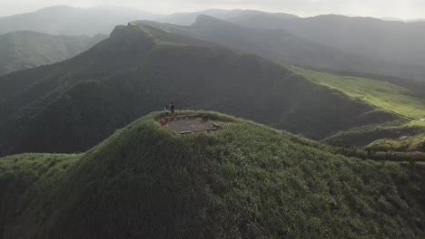 standing on the peak of a mountain top in taiwan