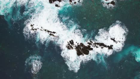 drone-top-shot-Rocky-cliffs,-Coast-in-Madeira,-rough-water