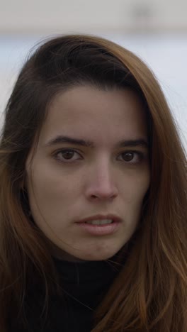close-up portrait of a young woman looking at the camera