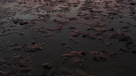 Tilt-view-of-sand-beach-and-wonderful-colors-of-the-sky-in-sunset-time-in-summer-season-the-coastal-town-rural-life-and-the-reflection-of-beautiful-landscape-in-water-pond-in-tidal-time-vivid-clouds