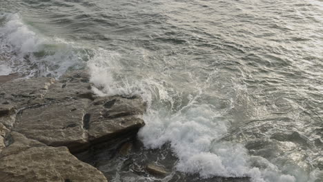 soft sea waves on the portugese shore in the coast of portugal