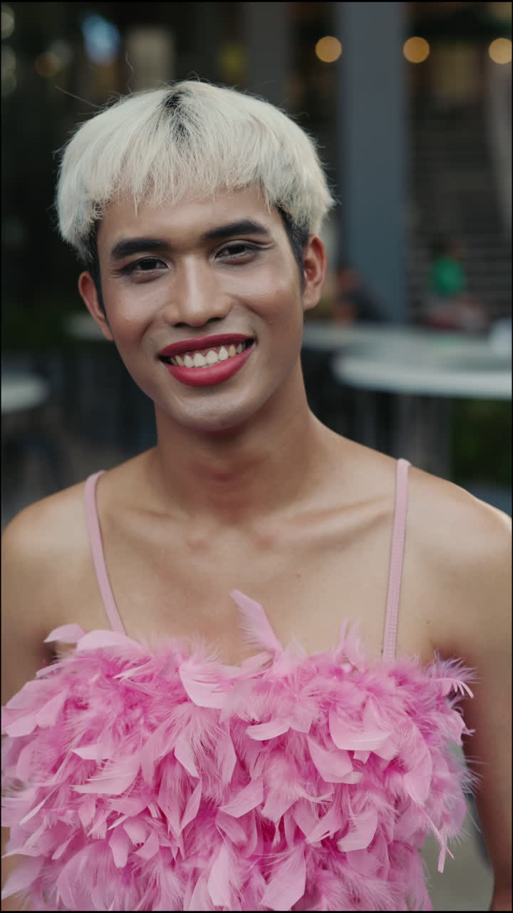 Portrait of a Smiling Person in Pink Feather Top