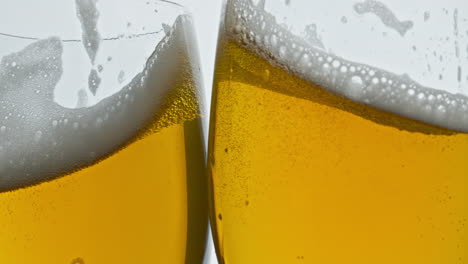 lager beer glasses cheers gesture closeup. full ale vessels toasting together