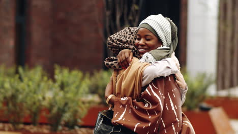 young muslim women meeting in park