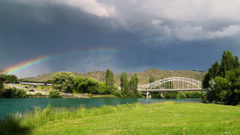 arched white color bridge in alexandra town, new zealand, just before rainfall