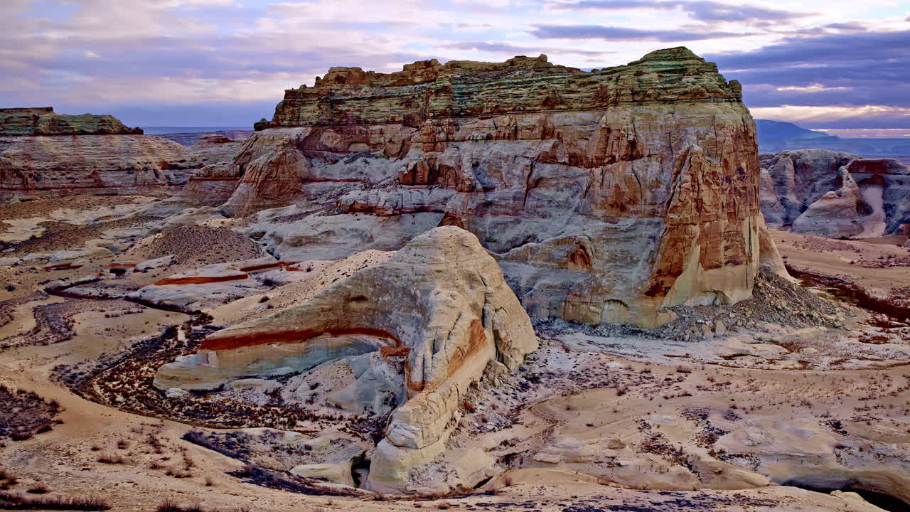 An awe-inspiring aerial shot highlighting the vibrant red rock formations and vast desert expanse near Lake Powell.