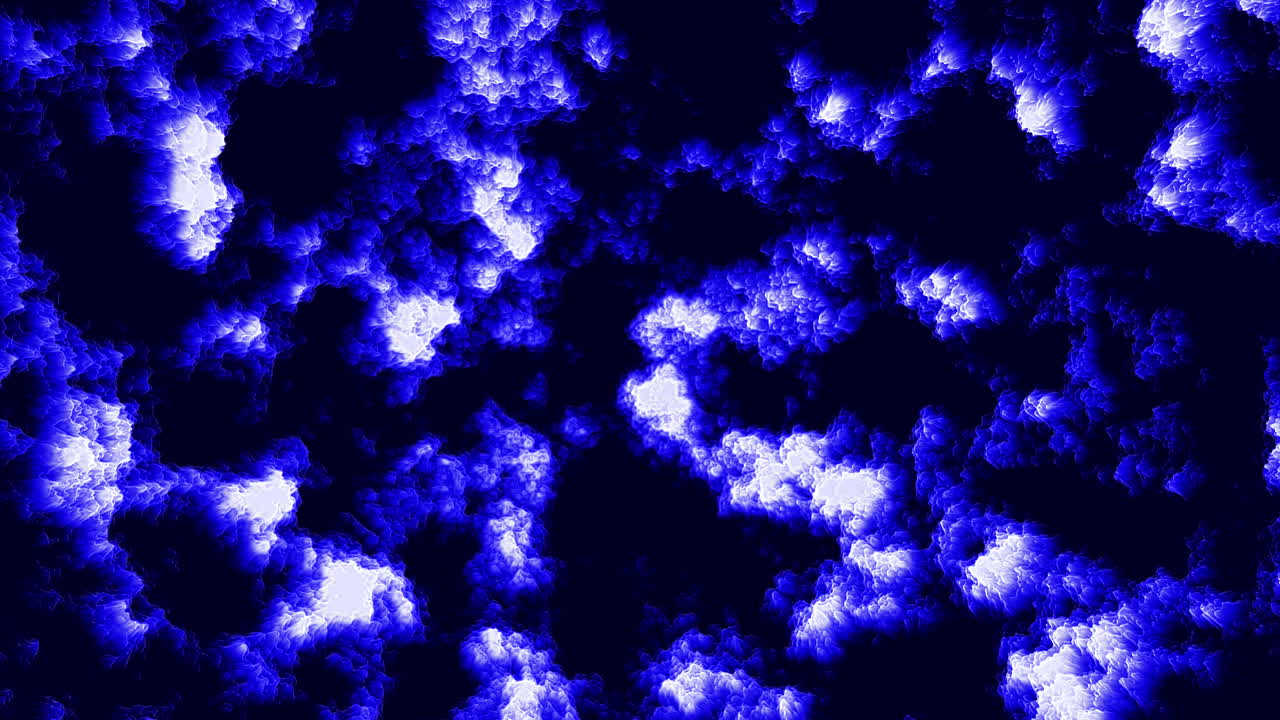 Un cielo azzurro sereno con nuvole bianche e gonfie che formano un affascinante motivo vorticoso, evocando un'atmosfera tranquilla ma dinamica nell'immagine