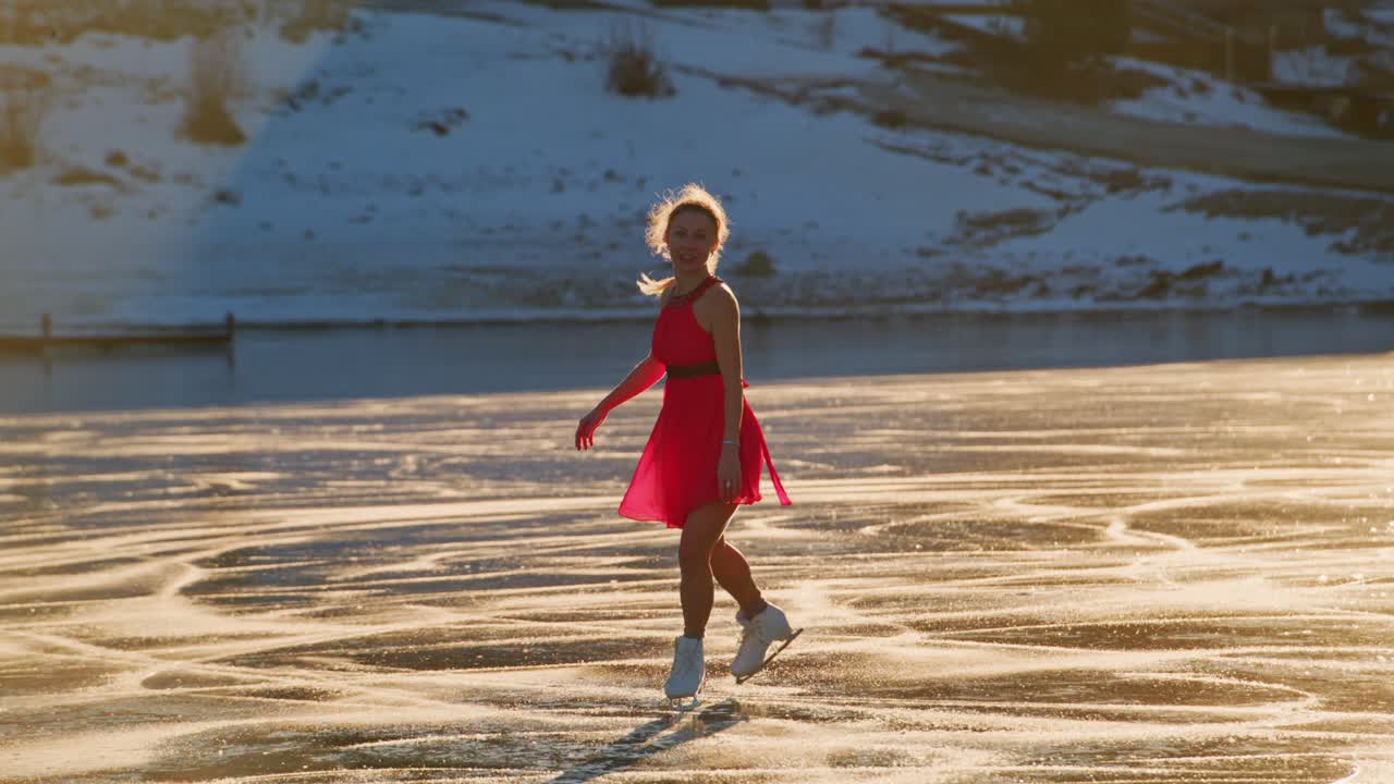 Woman ice skating on frozen lake