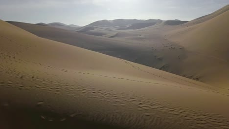 Ascending-aerial-view-of-desert-landscape