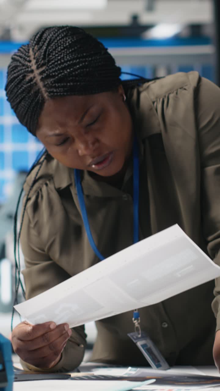 Vertical Video Woman industrial expert performing quality control on solar power production