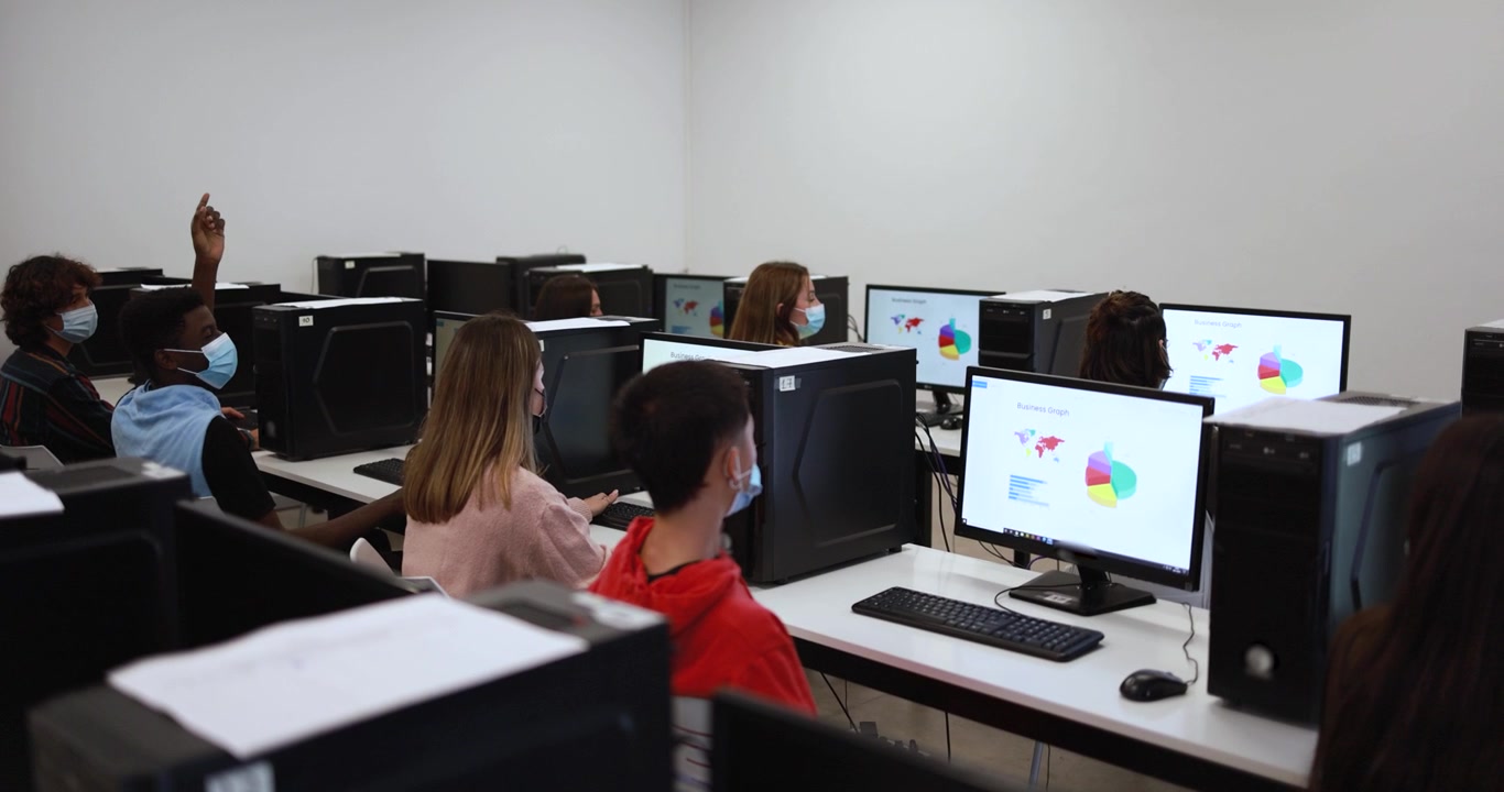 Students Working on Computers in a Classroom Setting