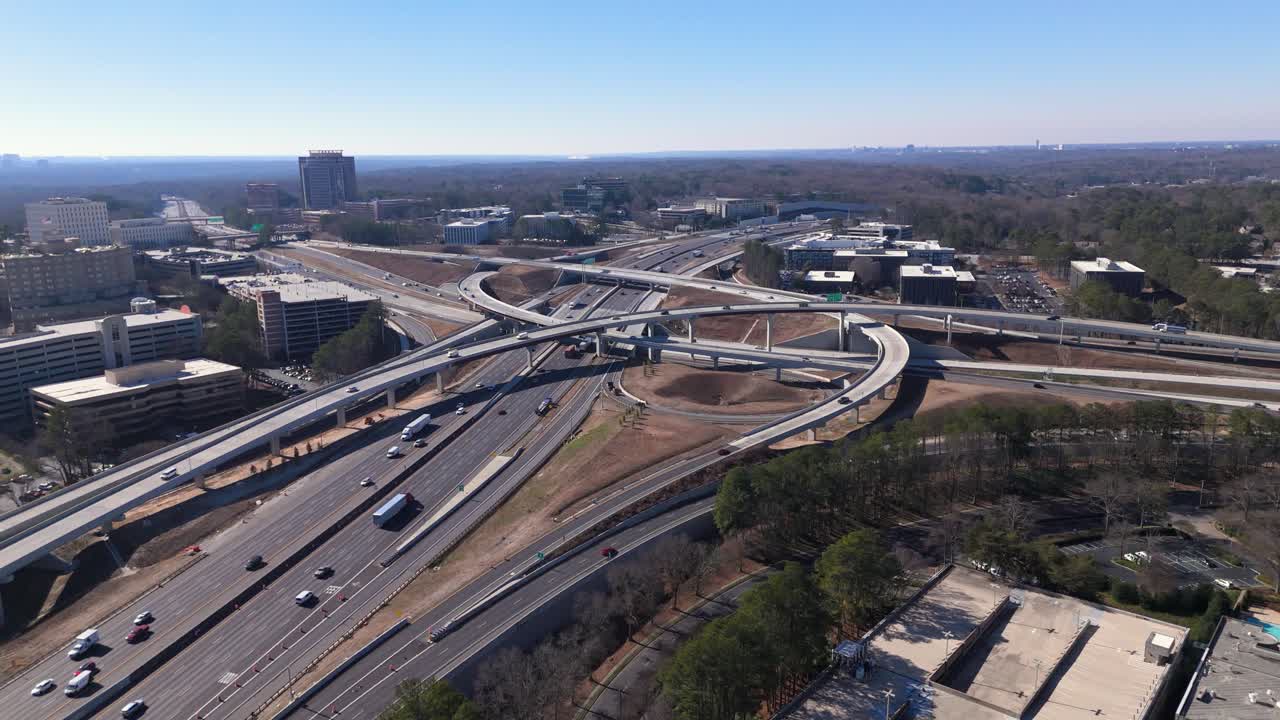 Static drone shot of GA-400 and I-285 traffic.