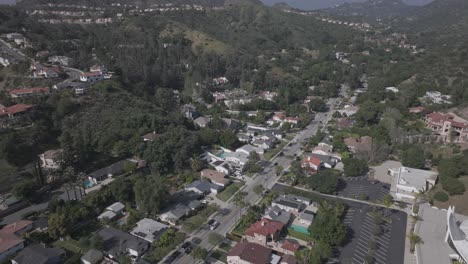 suburban street in eagle rock neighborhood and san rafael hills in los angeles, aerial flyover.