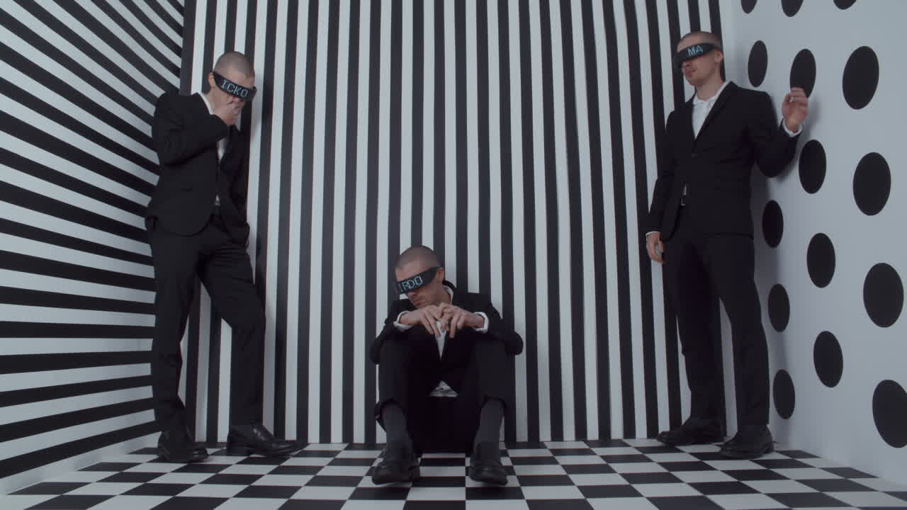 Blindfolded Men in a Black and White Studio