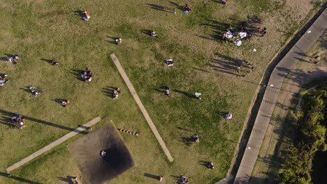 birds eye view of people chilling in the park at the coastal area of buenos aires