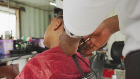 African-man-making-braids