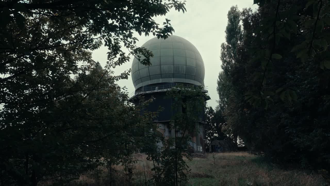 Abandoned Radar Dome Structure in Overgrown Forest