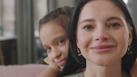 a mother and daughter share a loving hug