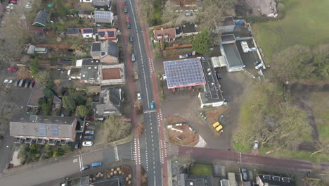 jib up of gas station with solar panels on rooftop